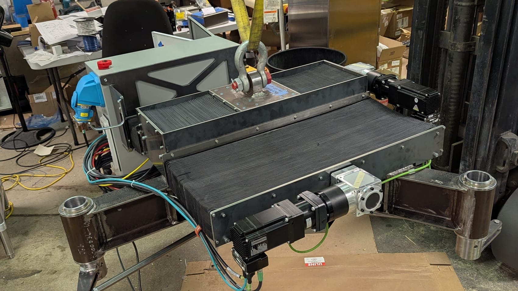 A belted conveyor module with servo drives, assembled on the floor of the Launch Partners shop