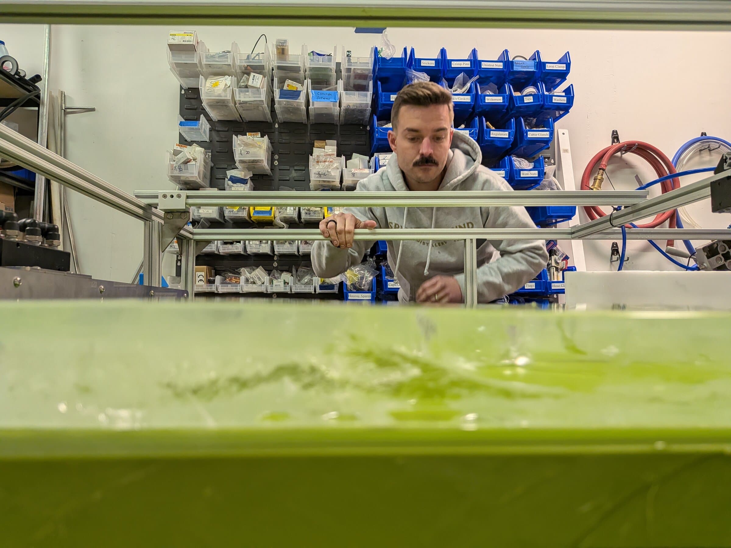 Engineer at a test tank on an R&D rig in the Launch Partners shop